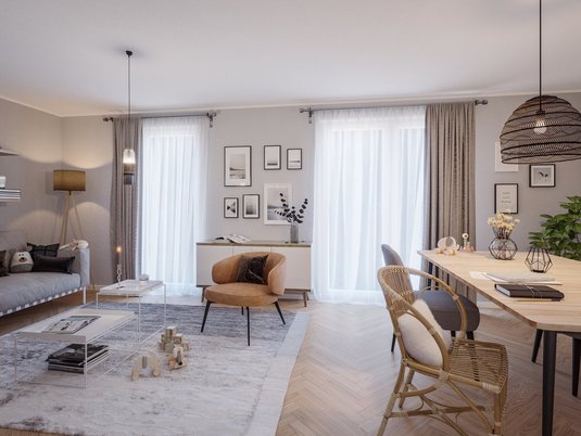 Ein modernes Wohnzimmer im Doppelhaus Behringen 116 mit klarer Einrichtung und viel Tageslicht zeigt, wie ein komfortabler Wohnbereich im eigenen Haus aussehen kann.