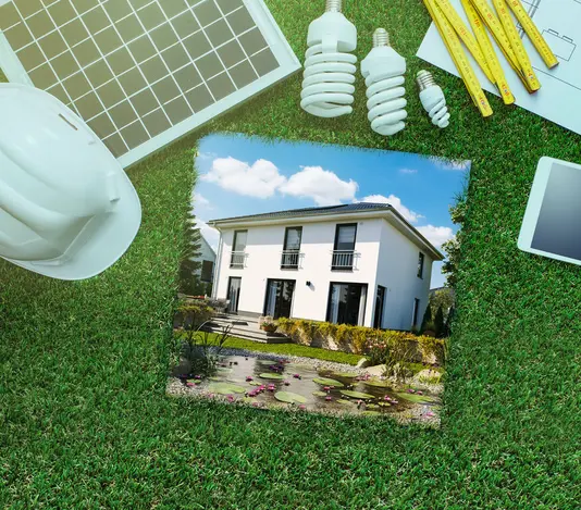 energie-sparen-haus-hausbau-geld-foerderung-01 Bild von einem Haus auf Rasen